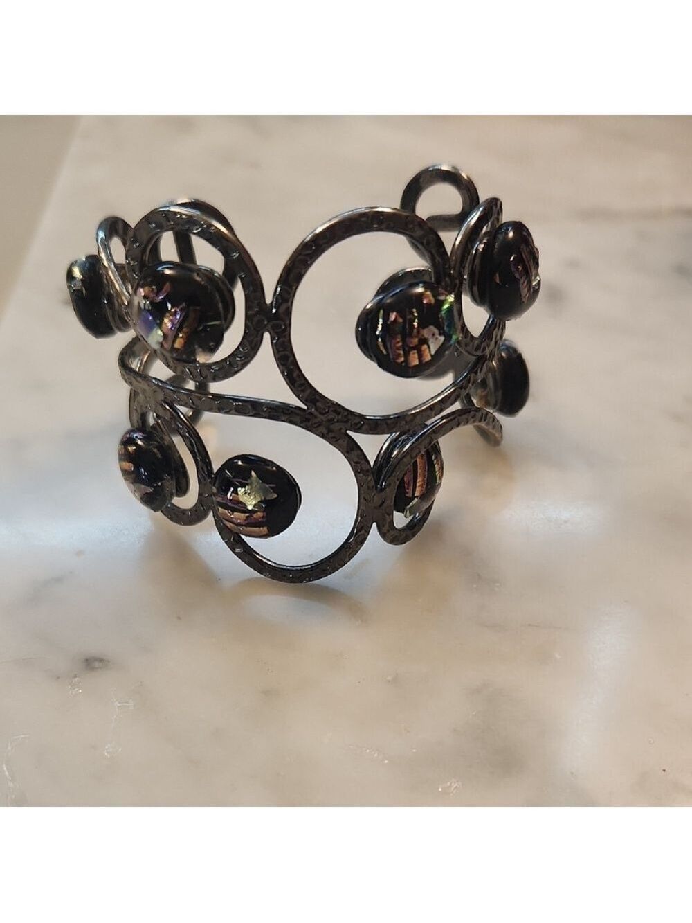 Intricate Black Scrollwork Bracelet with Amber Accents
